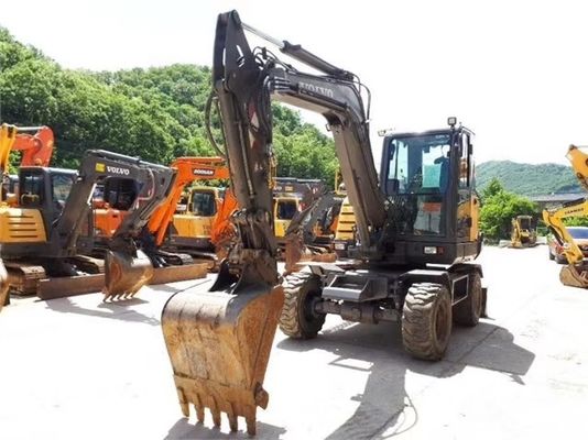 Excavadora de ruedas Volvo EW60 de segunda mano en buen estado y con otra capacidad de cubo